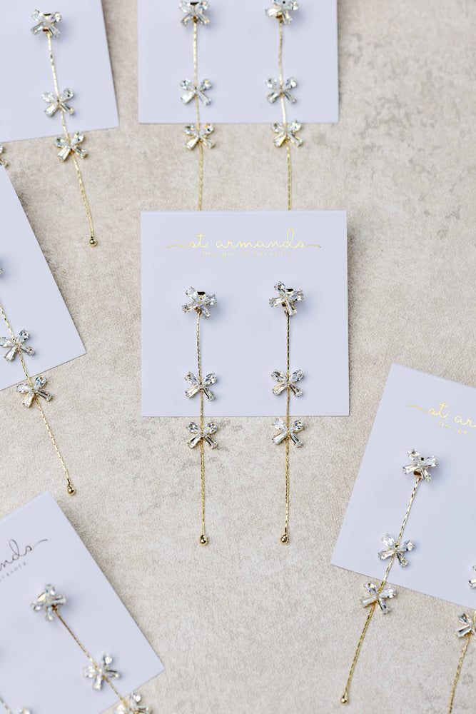 St Armands Designs of Sarasota - Diamond Bow Gold Duster Drop Earrings